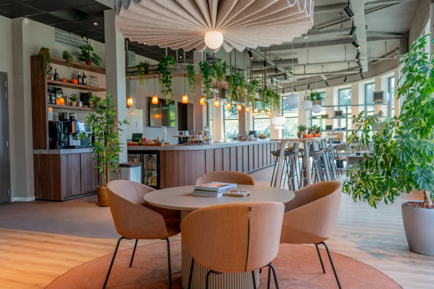 A table ready for visitors in the bright Bits + Bytes workspace café in the Reset building