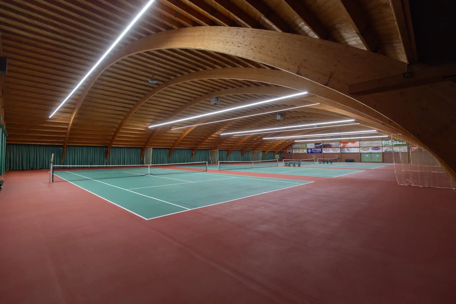 Illuminated indoor tennis courts from the Eventlogic story