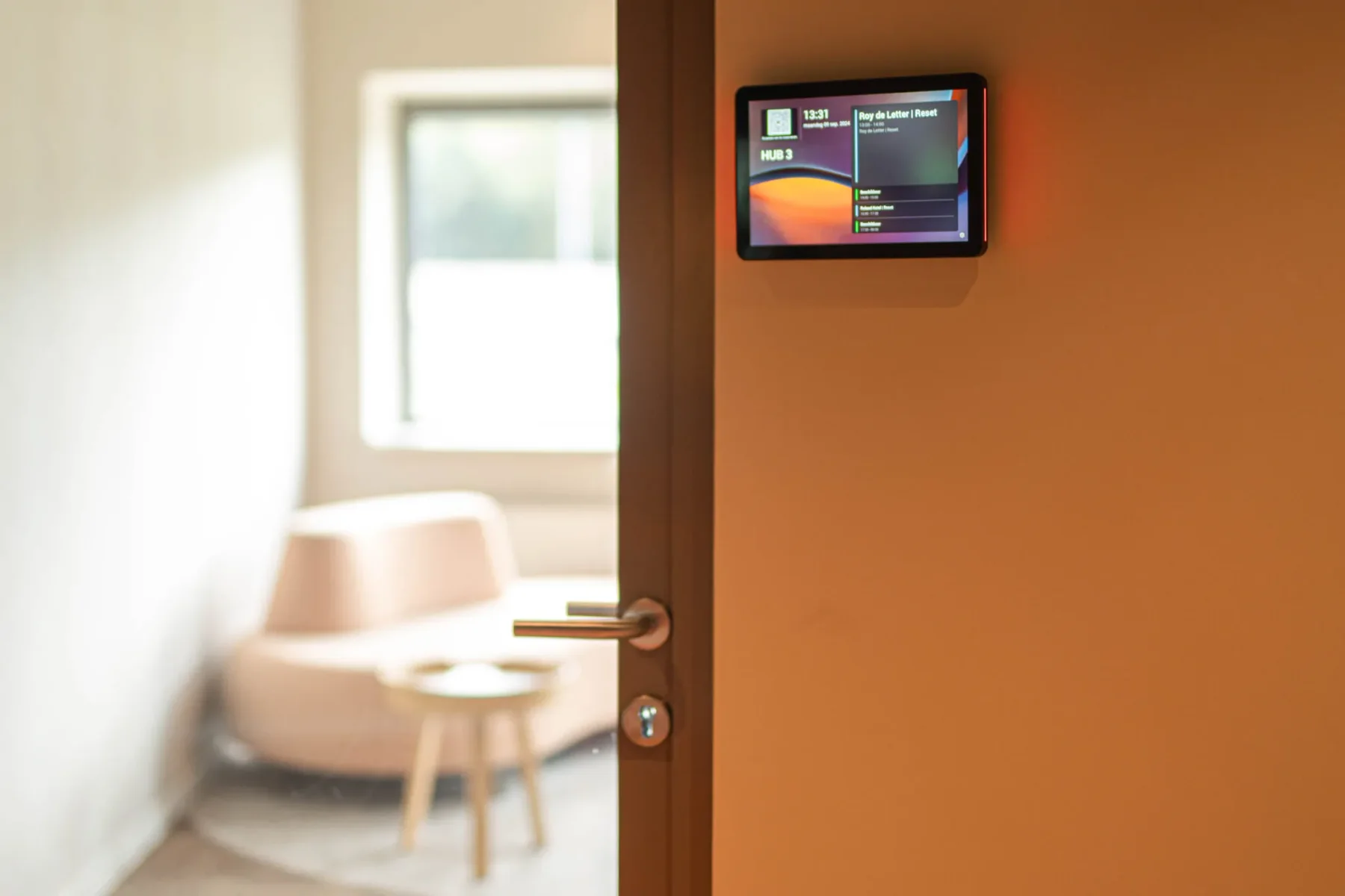 Meeting room with a digital control panel in the Reset demonstration office